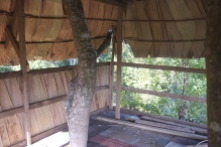 A thatched roof on one side for some privacy from the walkway below.